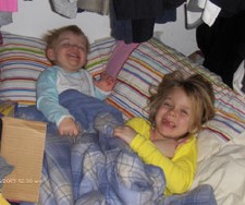Hannah and Summer enjoy a fort in the closet